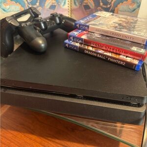 Sony PlayStation 4 Console with Controller and Games - Black